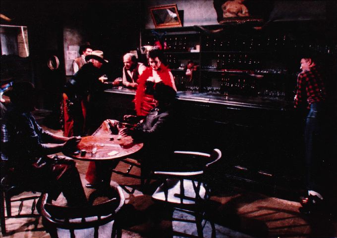 The atmospheric bar room interior. Cleo Rocos with the feather boa.