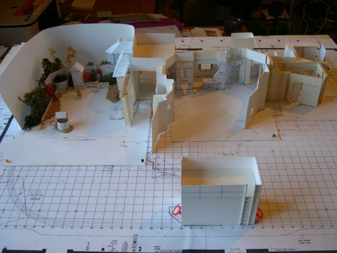 The overall set group composite model.The upstage,raised white platform supported the attic set (not shown) and the garden replaced the Basement in the final series.The foreground 'box' was for the follow spot operator and below the children's parents in a viewing booth.