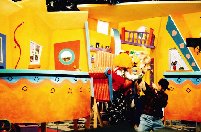The inside of our colourful house. Francis Wright (puppeteer) in action